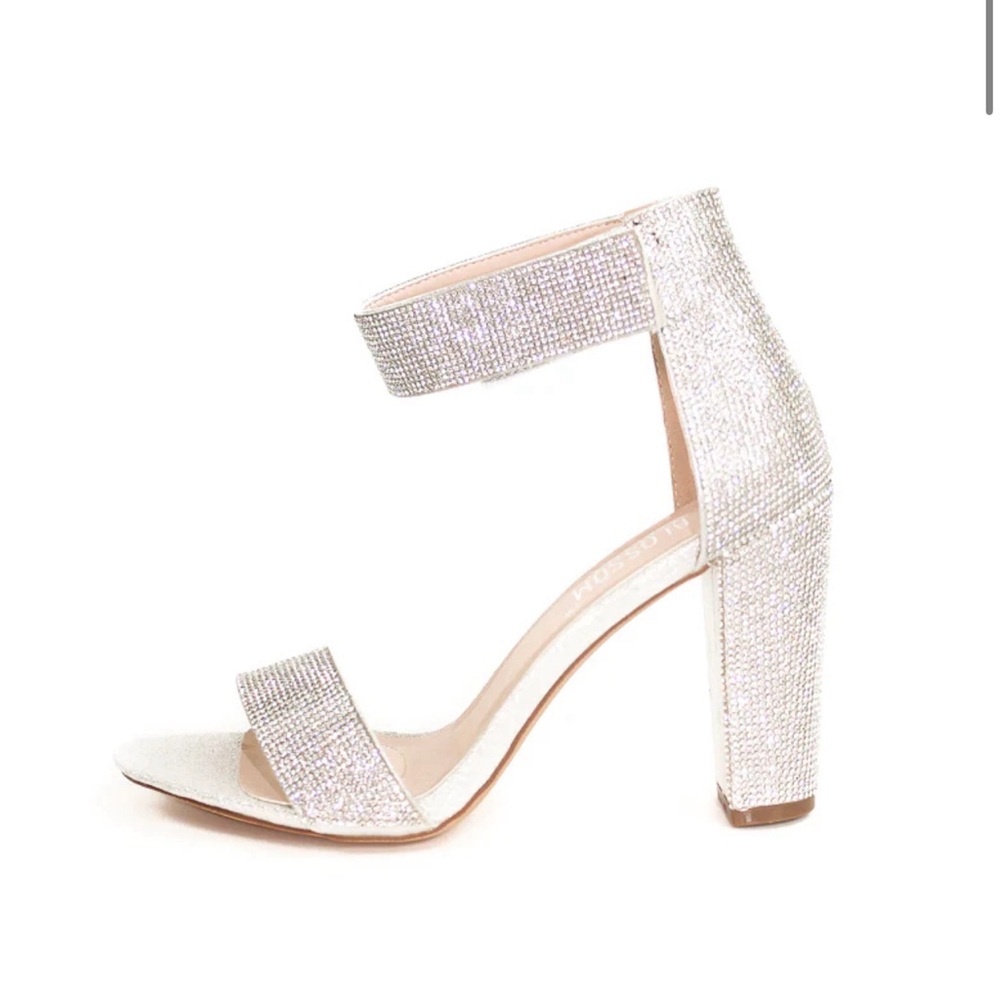 Crystal embellished ankle strap heel.